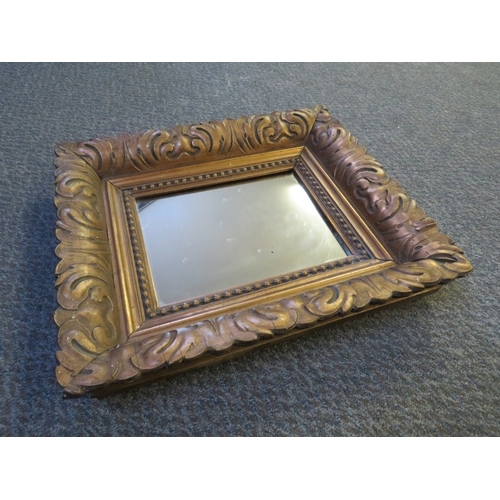 488 - A CIRCULAR CARVED WOOD AND GILT GESSO FRAMED CONVEX MIRROR, Dia. 56 cm, together with a gilt acanthu... 