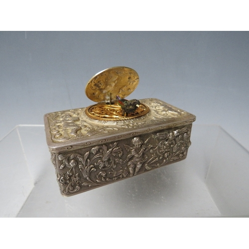 143 - A 19TH CENTURY CONTINENTAL SILVER AUTOMATON MUSICAL BIRD BOX, the case decorated with winged cherubs... 