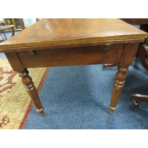 509 - A FRENCH PROVINCIAL DRAWLEAF FRUIT WOOD TABLE, with a single frieze drawer, raised on turned support... 