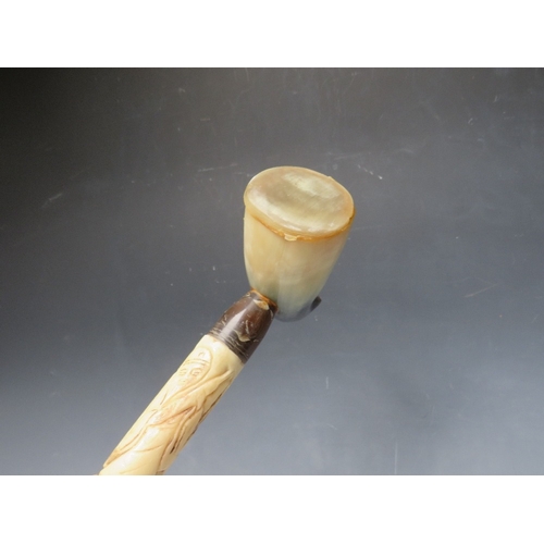 472 - A CARVED BONE WALKING STICK WITH HORN HANDLE, overall L 92 cm