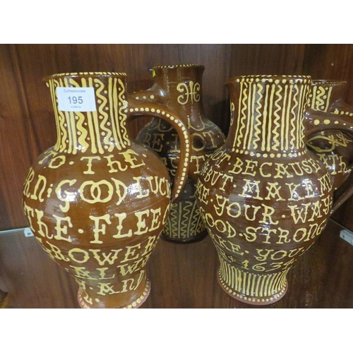 195 - FOUR ANTIQUE STYLE SLIP WARE JUGS