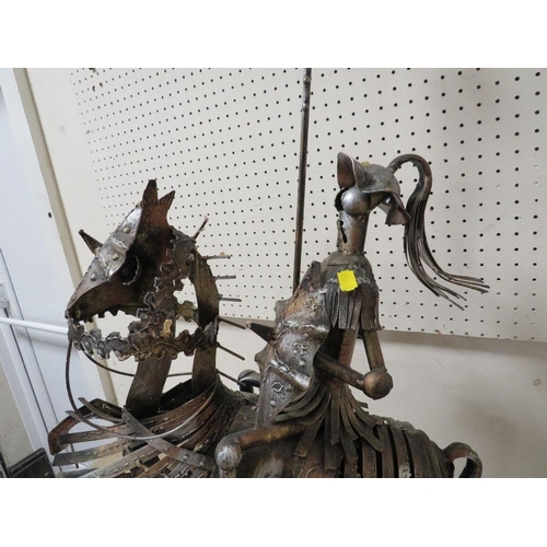 223 - AN UNUSUAL METAL KNIGHT ON HORSEBACK SCULPTURE