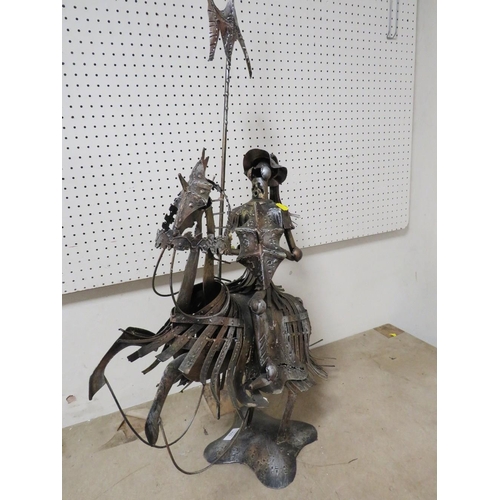 223 - AN UNUSUAL METAL KNIGHT ON HORSEBACK SCULPTURE