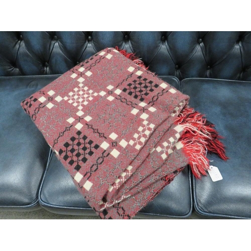 228 - A LARGE WOOL BLANKET WITH TASSEL EDGING