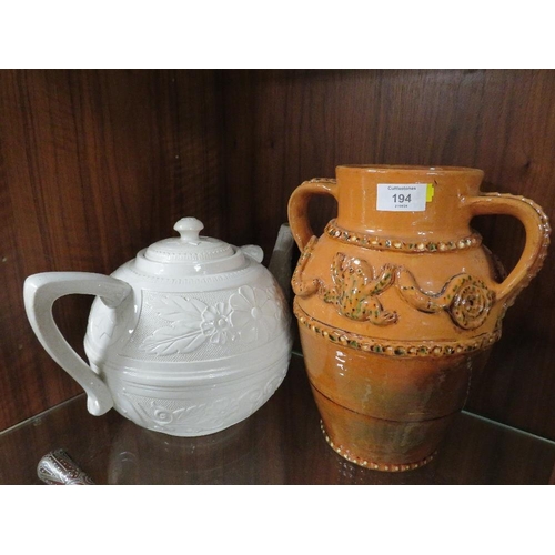 194 - A LARGE CREAM WARE TEA POT TOGETHER WITH A STONE WARE FROG TWIN HANDLED VASE