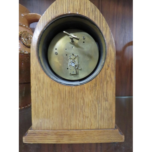 199 - AN EDWARDIAN OAK INLAID MANTEL CLOCK