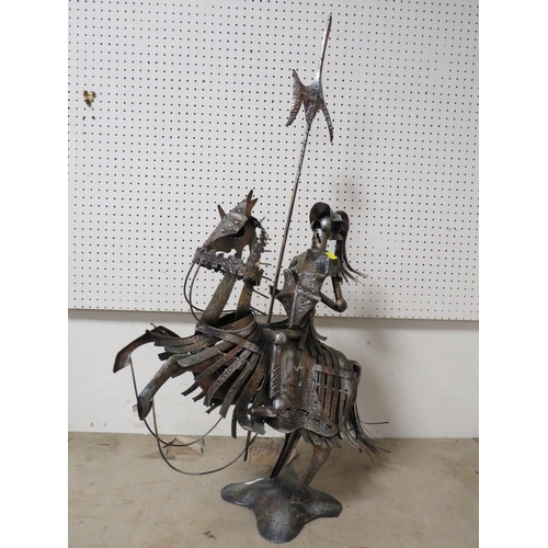 223 - AN UNUSUAL METAL KNIGHT ON HORSEBACK SCULPTURE