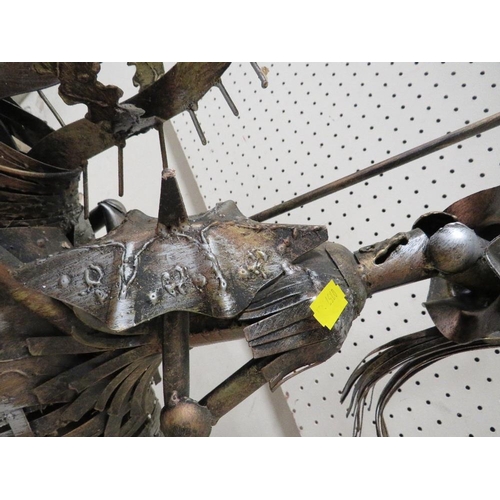 223 - AN UNUSUAL METAL KNIGHT ON HORSEBACK SCULPTURE