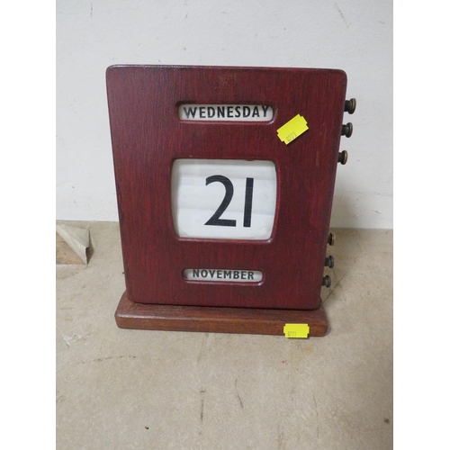 225 - A HOME MADE WOODEN DESK CALENDAR