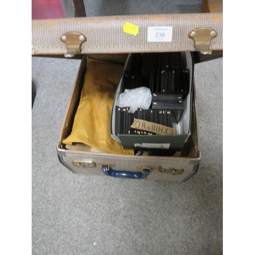 230 - A SUITCASE CONTAINING A HEURTIER PROJECTOR TOGETHER WITH A SMALL BOX OF PRINTED SLIDES