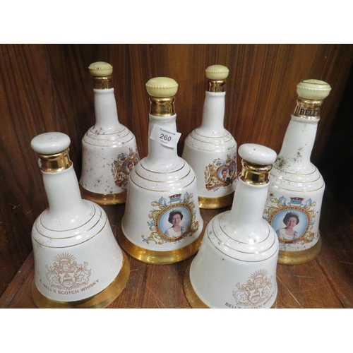 260 - A SET OF SIX BELLS SCOTCH WHISKY DECANTERS