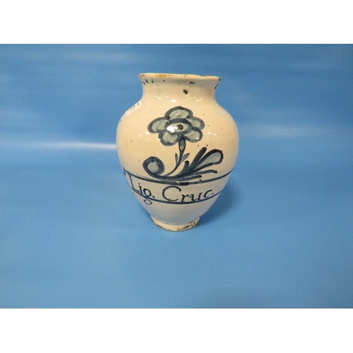 275 - AN ANTIQUE DELFT DRUG JAR, INSCRIBED 'LIG. CRUC' WITH A FLOWER ABOVE H 19 CM