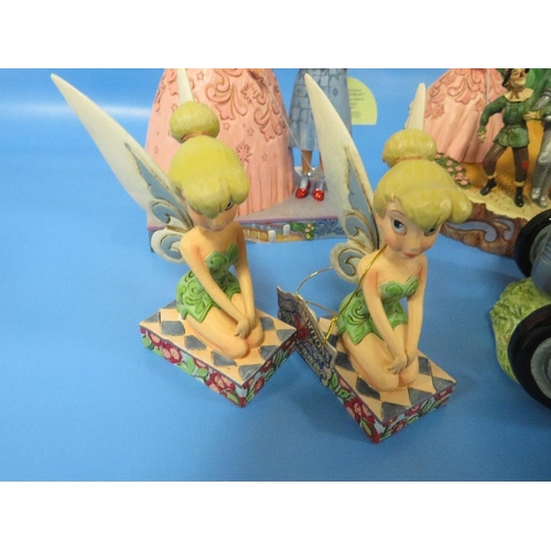 281 - TWO TINKERBELL FIGURES WITH TWO WIZARD OF OZ FIGURES AND A MODEL OF A TRACTOR (5)