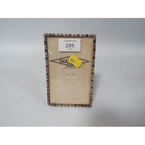 295 - A SMALL HALLMARKED SILVER RECTANGLE PHOTO FRAME