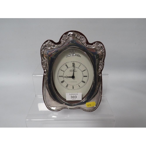 303 - A HALLMARKED SILVER TABLE CLOCK