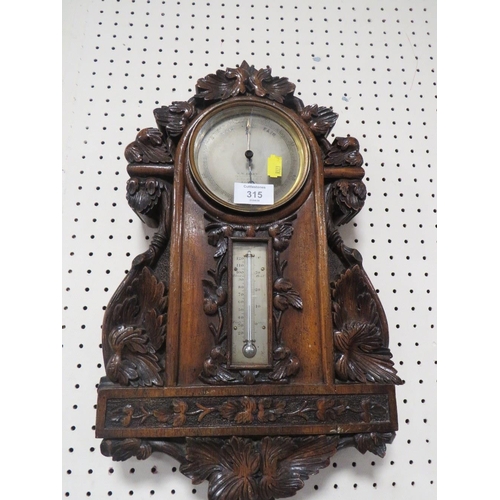 315 - AN ANTIQUE HEAVILY CARVED WALL BAROMETER A/F