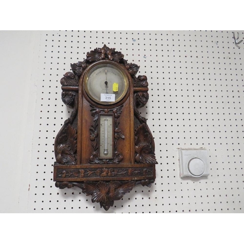 315 - AN ANTIQUE HEAVILY CARVED WALL BAROMETER A/F