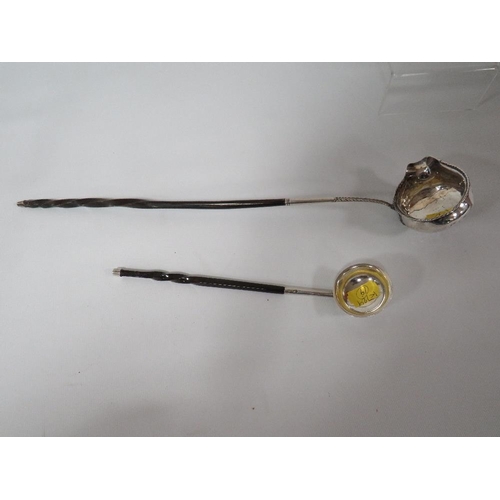 322 - TWO WHITE METAL PUNCH LADLES WITH EBONISED HANDLES