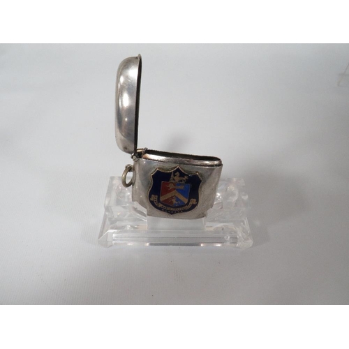 323 - AN ENAMEL AND SILVER PLATED VESTA CASE, THE LATER APPLIED THE TOWN BADGE OF MARGATE