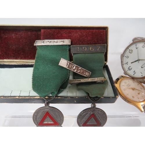 337 - A SELECTION OF VINTAGE WRIST WATCHES , SAFE DRIVING MEDALS ETC