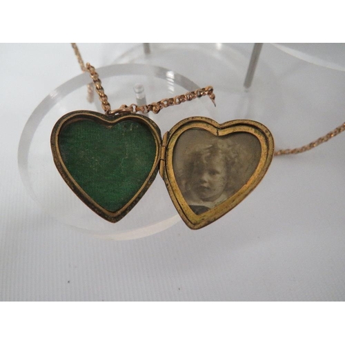 362 - AN ANTIQUE LOCKET AND CHAIN - LOCKET MARKED 9CT BACK AND FRONT