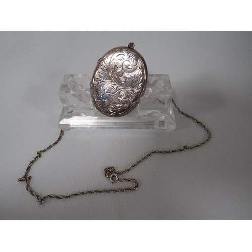 376 - A LARGE HALLMARKED SILVER ENGRAVED LOCKET ON CHAIN