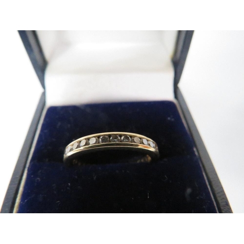 377 - AN 18K CHANNEL SET  DIAMOND FULL ETERNITY RING ring size n 1/2 approx weight 3.9g