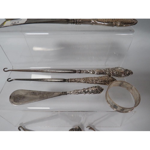 383 - A SELECTION OF HALLMARKED SILVER COLLECTABLE'S TO INCLUDE SILVER HANDLED BUTTON HOOKS, SHOE HORNS ET... 