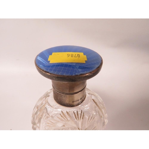 389 - A HALLMARKED SILVER AND BLUE GUILLOCHE ENAMEL CUT GLASS SCENT BOTTLE TOGETHER WITH ANOTHER (2)