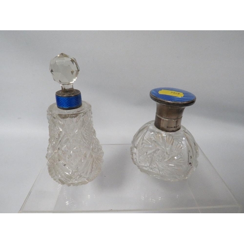 389 - A HALLMARKED SILVER AND BLUE GUILLOCHE ENAMEL CUT GLASS SCENT BOTTLE TOGETHER WITH ANOTHER (2)