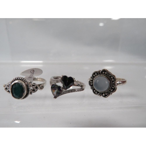 398 - THREE DECORATIVE SILVER DRESS RINGS TO INCLUDE A MYSTIC TOPAZ STYLE EXAMPLE