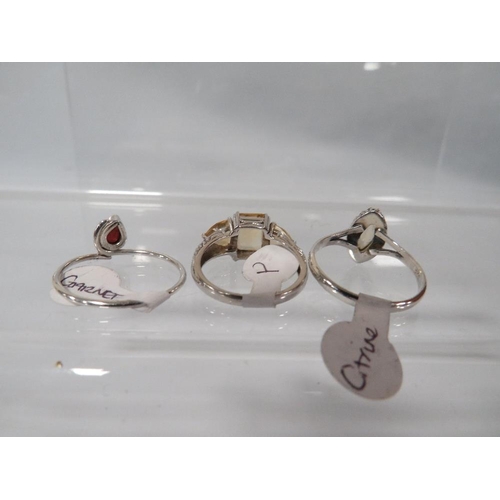 401 - THREE ASSORTED SILVER DRESS RINGS