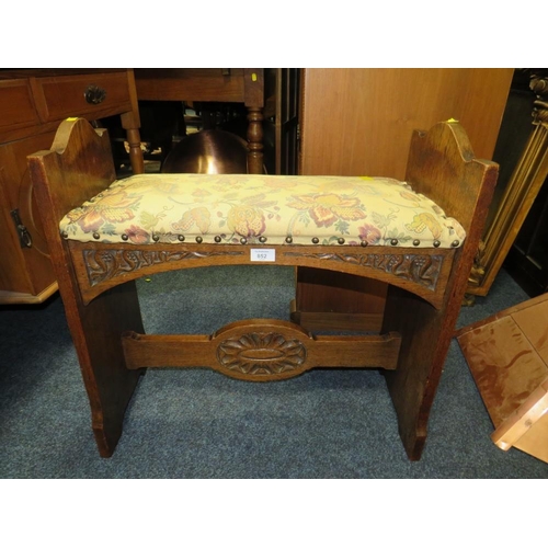 852 - A CARVED OAK AND UPHOLSTERED BENCH SEAT - W 66 CM