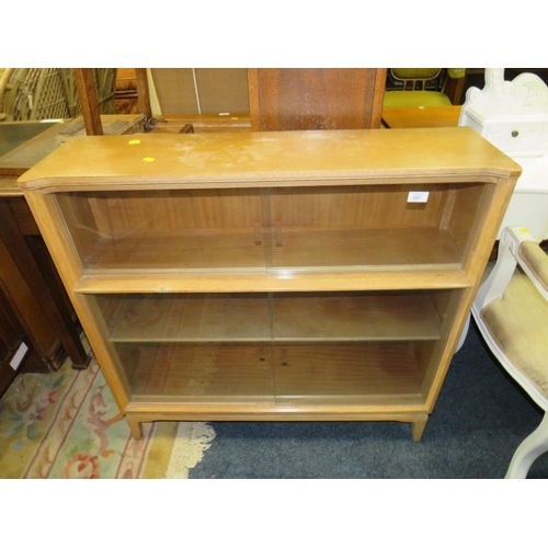 857 - AN OAK UTILITY STYLE GLAZED BOOKCASE