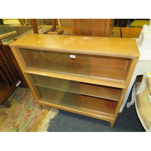 857 - AN OAK UTILITY STYLE GLAZED BOOKCASE