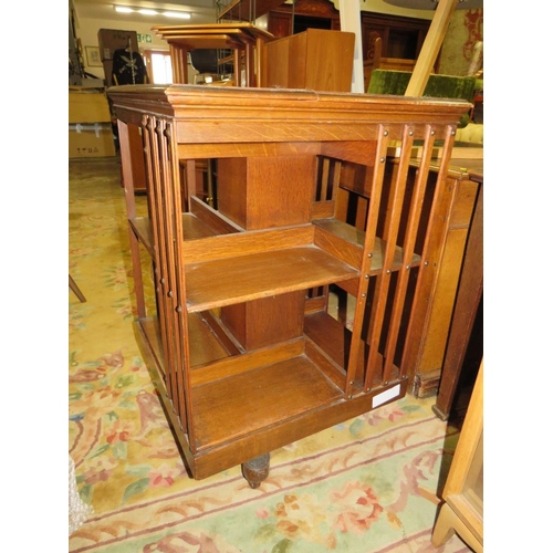 858 - A VINTAGE OAK REVOLVING BOOKCASE