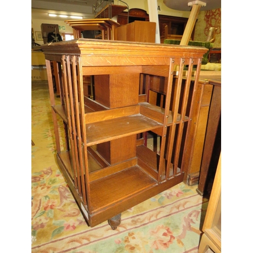 858 - A VINTAGE OAK REVOLVING BOOKCASE