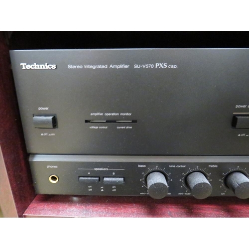 859 - A TECHNICS SU-V570 AMP AND AN SL-P477A CD PLAYER IN CABINET