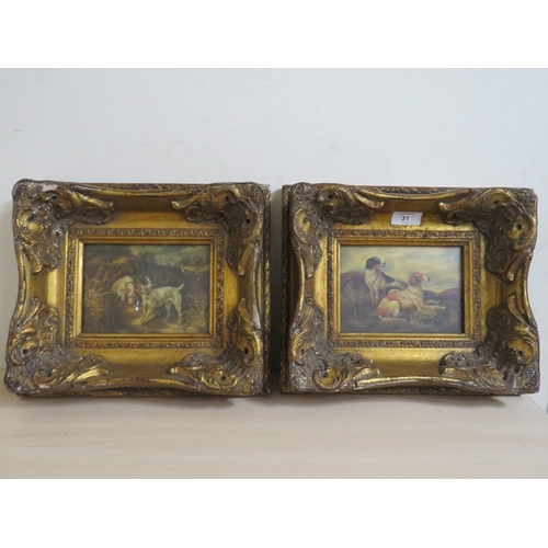 31 - A PAIR OF HEAVY GILT FRAMED REPRODUCTION DOG PRINTS