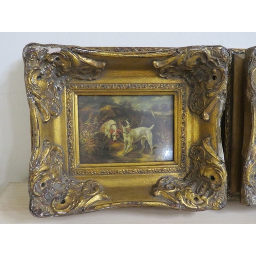 31 - A PAIR OF HEAVY GILT FRAMED REPRODUCTION DOG PRINTS