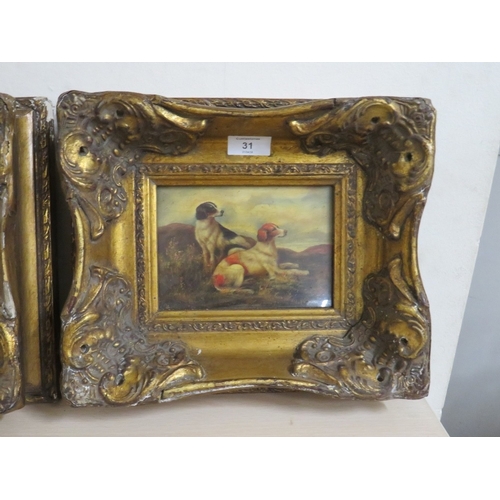 31 - A PAIR OF HEAVY GILT FRAMED REPRODUCTION DOG PRINTS