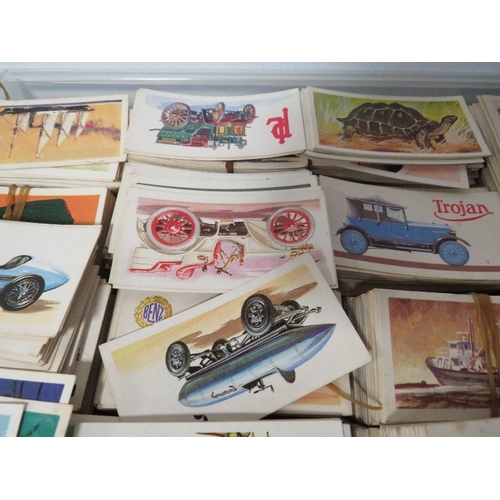 239 - THREE TRAYS OF ASSORTED CIGARETTE CARDS TO INCLUDE SHIPS, CARS ETC