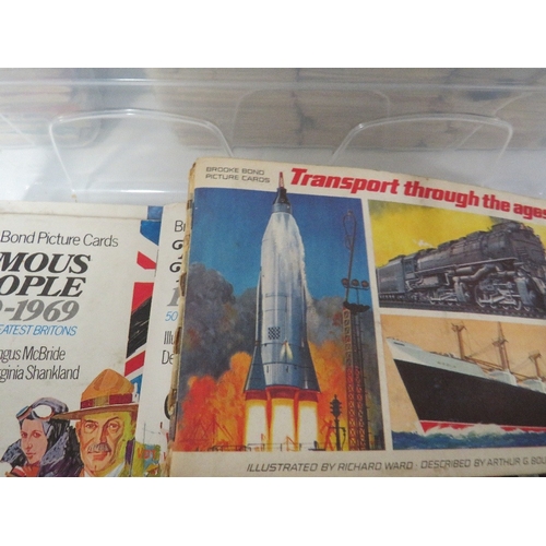 239 - THREE TRAYS OF ASSORTED CIGARETTE CARDS TO INCLUDE SHIPS, CARS ETC