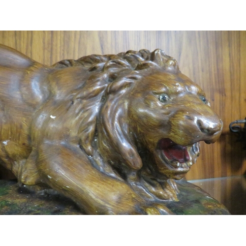 253 - A LARGE POTTERY LION MODEL