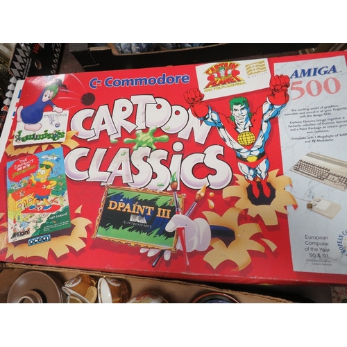 56 - A BOXED COMMODORE AMIGA 500 TOGETHER WITH A SMALL SELECTION OF GAMES (ALL UNCHECKED)