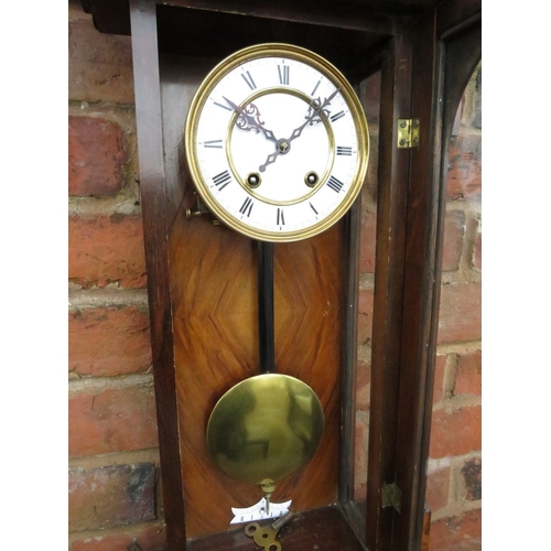 866 - A MAHOGANY CASED VIENNA GONG STRIKE WALL CLOCK, having an 8 day German movement and white enamel dia... 