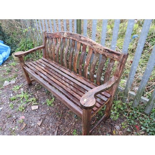 601 - A SOLID HARDWOOD ARCH BACK GARDEN BENCH