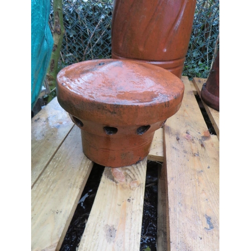 602 - TWO TERRACOTTA CHIMNEY POTS AND TWO COWLS