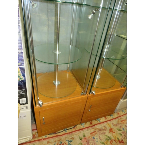 702 - A PAIR OF MODERN SQUARE LIGHT-UP REVOLVING DISPLAY CABINETS