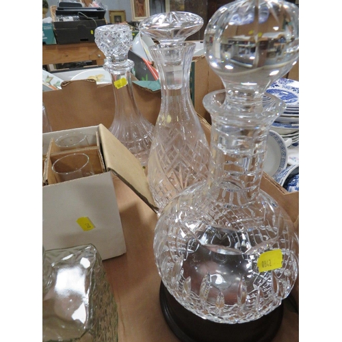 145 - A QUANTITY OF CUT GLASS DECANTERS ETC